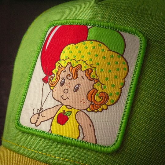 Close-up of woven patch featuring  'Apple Dumplin' from Strawberry Shortcake.