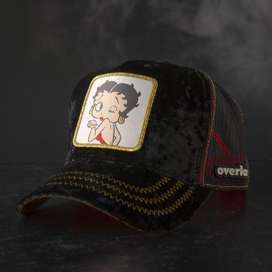 Black crushed velvet trucker cap featuring a woven patch of Betty Boop blowing a kiss attached to the crown.