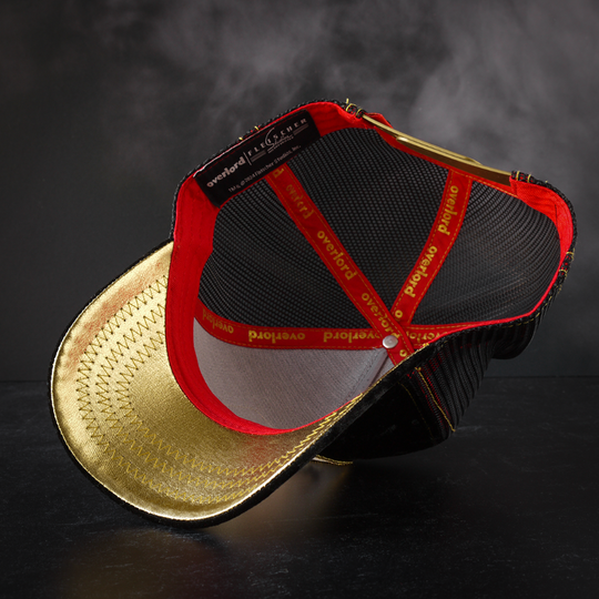 Black crushed velvet trucker cap with gold satin underbrim