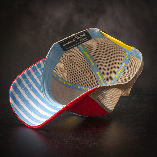 Inside view of red corduroy trucker cap hat with blue and white striped fabric underbrim