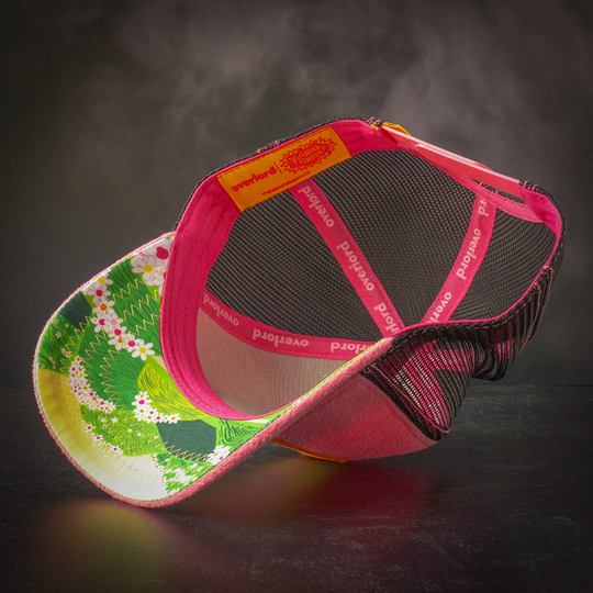 Inside view of pink fleece trucker cap hat with Foofa's world printed on underbrim