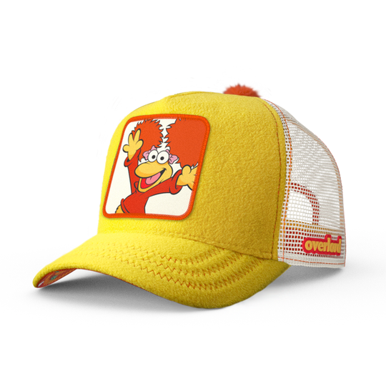 Yellow fleece trucker cap hat with Fraggle Rock Red woven patch against white background