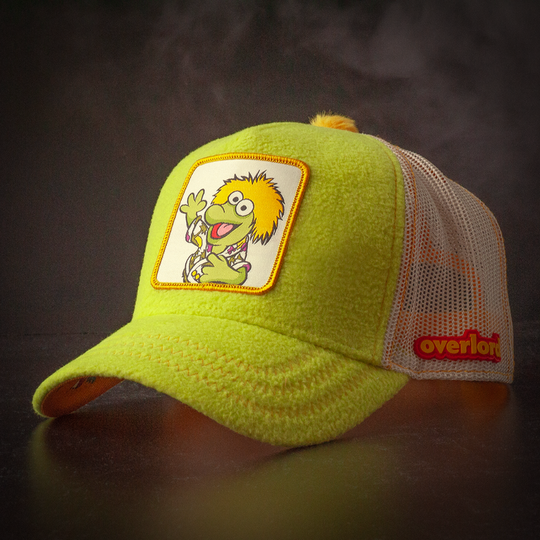 Yellow fleece trucker cap hat with Fraggle Rock Wembley woven patch against black background