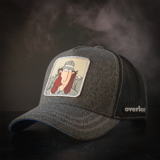 Dark gray cashmere trucker cap hat with Inspector Gadget woven patch against a black background