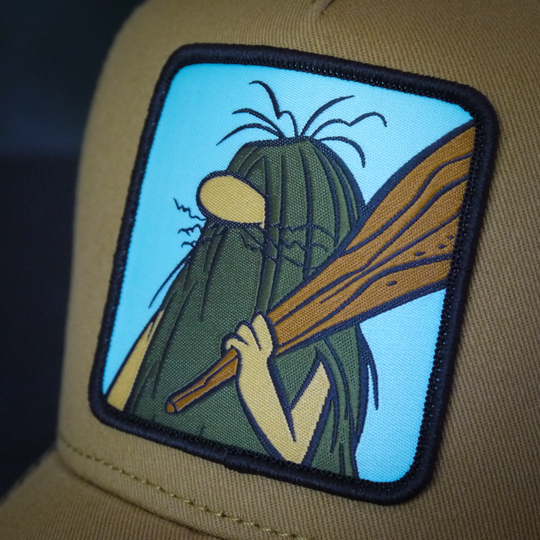 Close-up of a woven patch of Captain Caveman from the classic Hanna-Barbera cartoons attached to the crown.