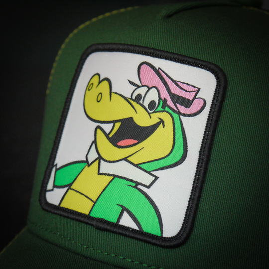 Close-up of a woven patch of Wally Gator from the classic Hanna-Barbera cartoons attached to the crown.