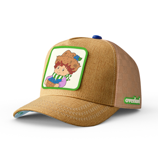 Brown linen trucker cap hat with Huckleberry Pie from Strawberry Shortcake on woven patch against a white background