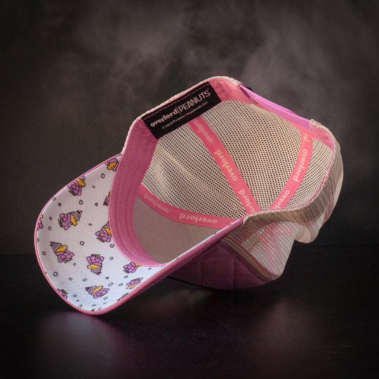 Inside view of quilted pink trucker cap hat with Peanuts Woodstock in pink jacket printed fabric underbrim