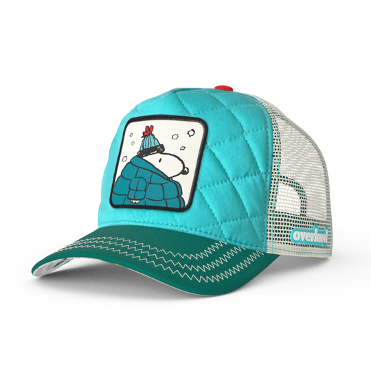 Quilted turquoise and teal Peanuts trucker cap hat with Snoopy in teal jacket woven patch against a white background