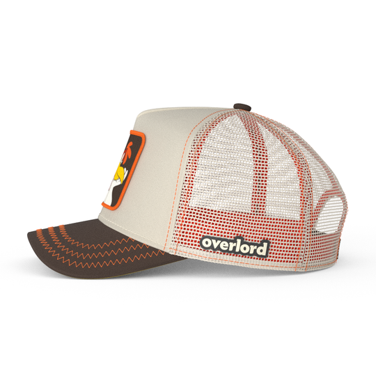 Side view of beige and brown trucker cap with a Foghorn Leghorn rooster patch on a white background