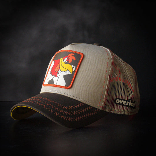 Beige and brown trucker cap with a Foghorn Leghorn rooster patch against a black background