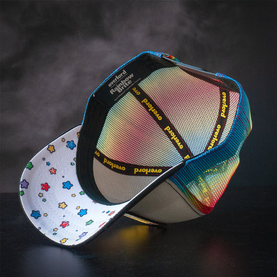 Black and white trucker cap hat with colorful stars printed on the underbrim