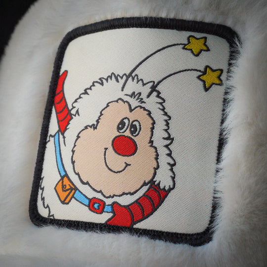 Close-up of Twink from Rainbow Brite on woven patch attached to trucker cap crown
