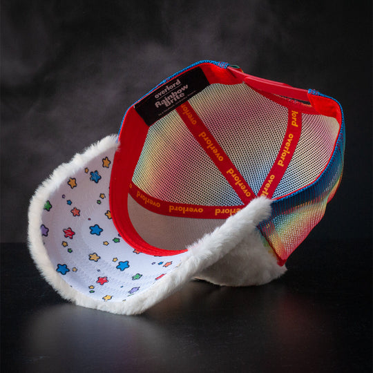 Inside view of white faux fur trucker cap hat with colorful stars printed on underbrim