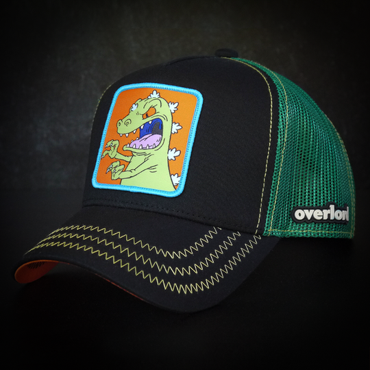 Black OVERLORD X Rugrats Reptar trucker baseball cap hat with green zig zag stitching. PVC Overlord logo.