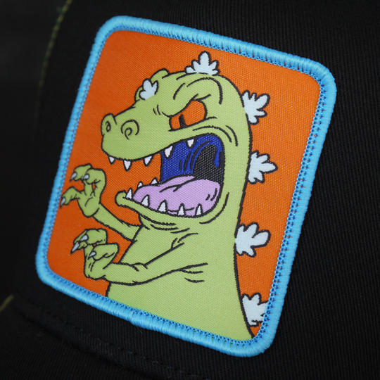 Black OVERLORD X Rugrats Reptar trucker baseball cap hat woven Overlord patch closeup.