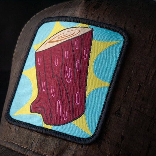 Close-up of Log from Ren and Stimpy on woven patch attached to trucker cap crown