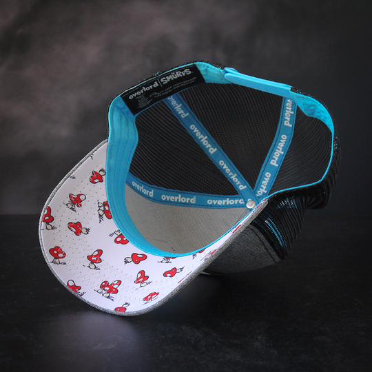 Inside view of heather gray trucker cap with red toadstool mushrooms printed on white underbrim