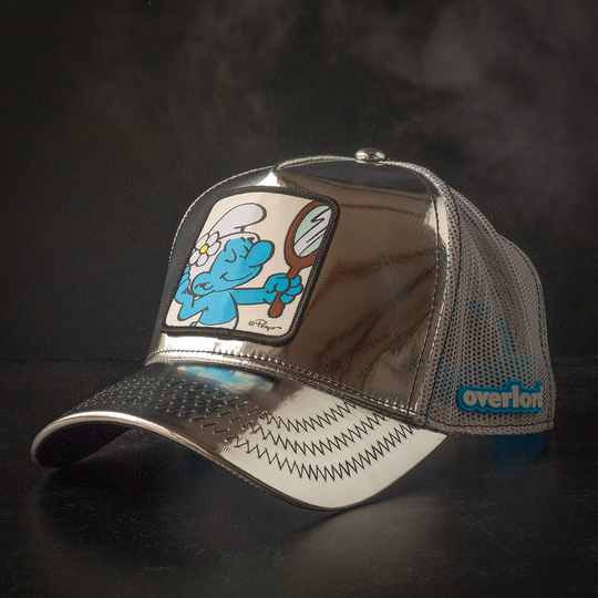 Metallic silver trucker cap with Vanity Smurf patch against a black background