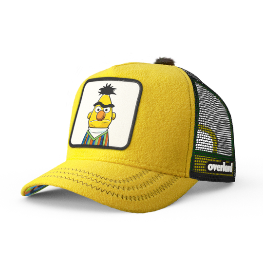 Yellow fleece trucker cap hat with Sesame Street Bert woven patch against a white background