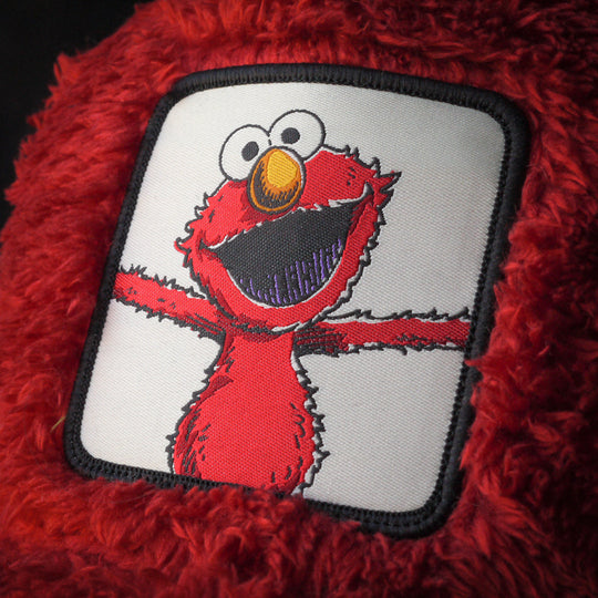 Close-up of Elmo from Sesame Street on woven patch attached to trucker cap crown