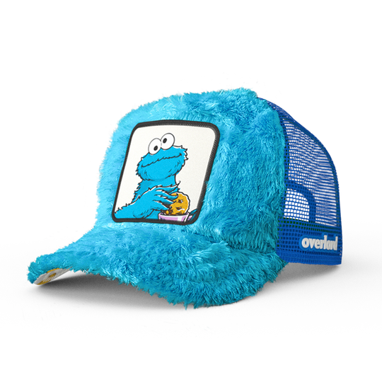 Turquoise faux fur trucker cap hat featuring Cookie Monster from Sesame Street on woven patch attached to crown