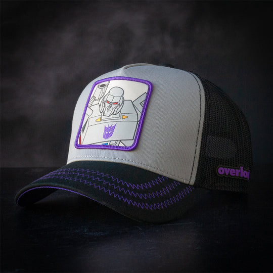 Gray and black trucker cap hat featuring Megatron from Transformers on woven patch attached to crown