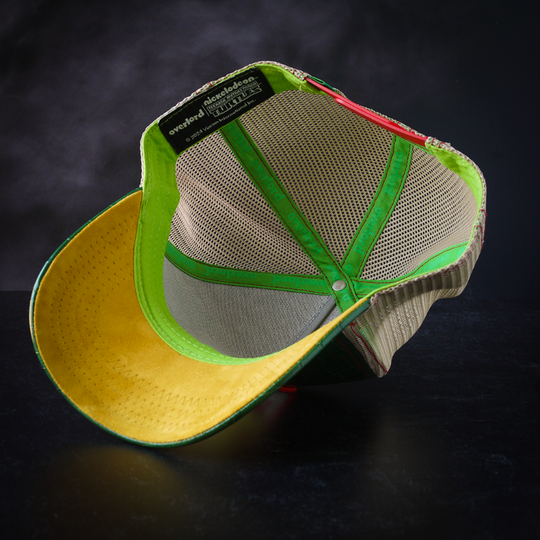Green faux crocodile leather trucker cap with yellow faux suede underbrim