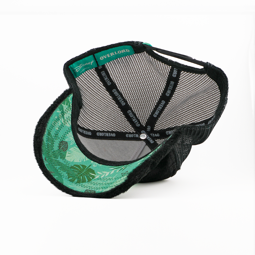 Two hats, one green with leaf pattern and one black mesh, on a white background.
