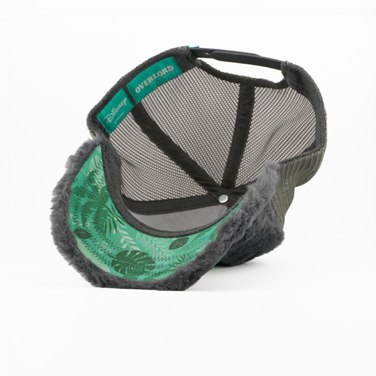 Trucker hat with green floral pattern and gray brim on a white background