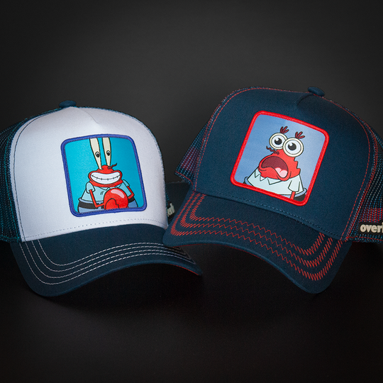 White and navy OVERLORD X SpongeBob Krusty Krab trucker baseball cap hat with cream stitching. PVC Overlord logo.