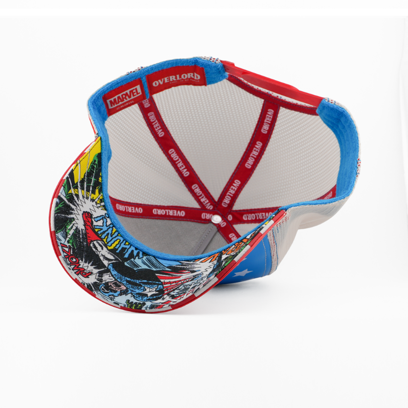 Underside view of the Captain America cap showing a comic-print brim, white mesh crown, and red Overlord branded taping.