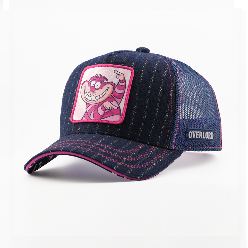 Navy blue cap with pink accents and a cartoon character patch on a white background