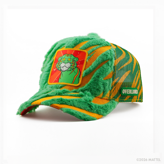 Green fuzzy-textured retro trucker cap with gold stripes and a red-background patch of Cringer from Masters of the Universe, green and gold mesh back, and Overlord logo.