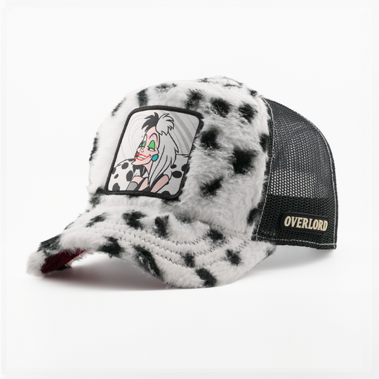 White and black spotted faux-fur retro trucker cap with Cruella de Vil from Disney's 101 Dalmatians patch, black mesh sides, and Overlord logo.
