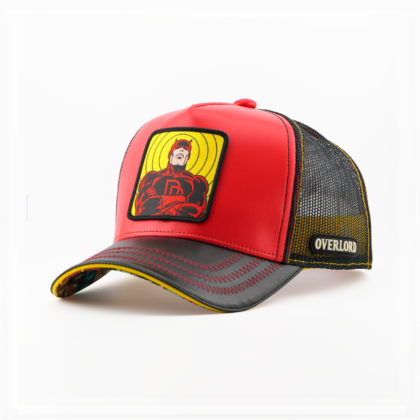 Red trucker cap with a Marvel's Daredevil patch on a yellow backdrop, a black brim, and a mesh side with the Overlord logo.