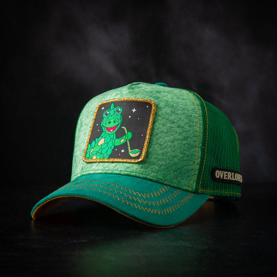 Green cap with a dragon patch on a dark background