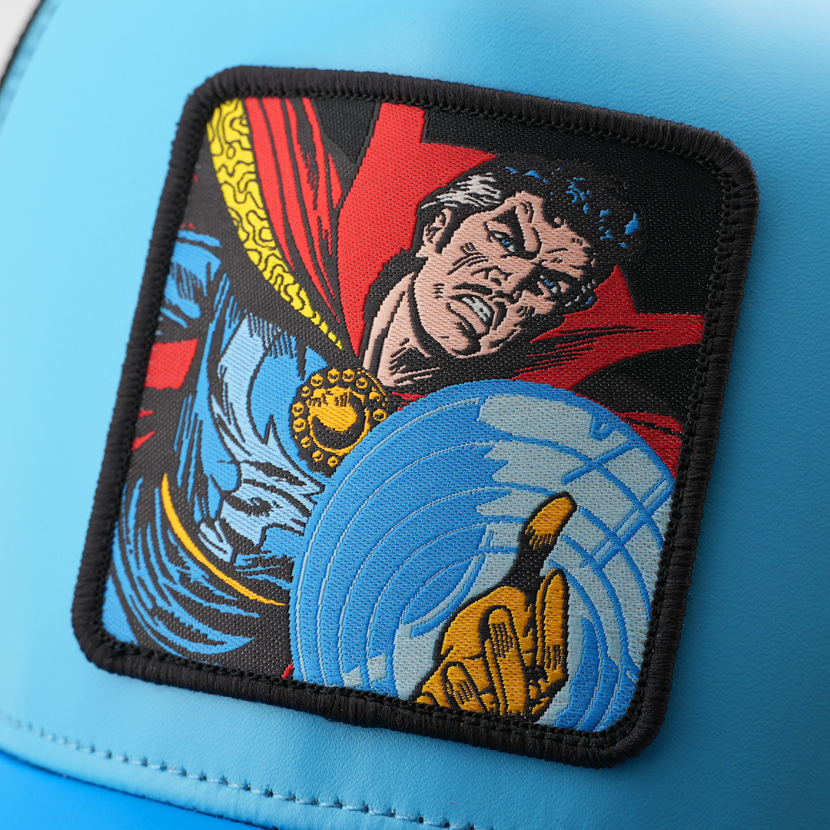 Close-up of a woven Marvel's Doctor Strange patch with a black border, stitched onto light blue cap fabric.