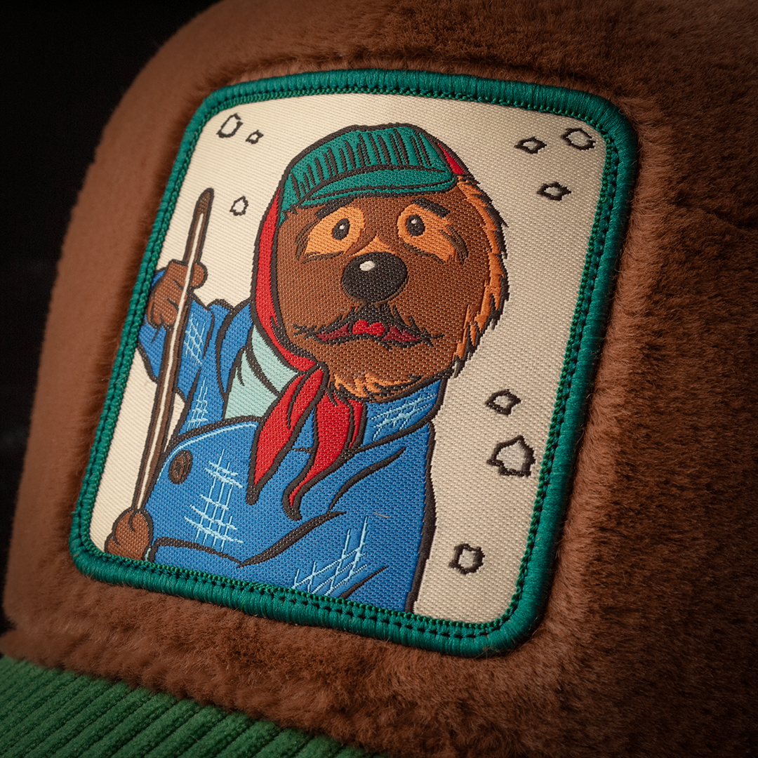 Close-up of a woven patch of Emmet the Otter from Emmet Otter attached to the crown.