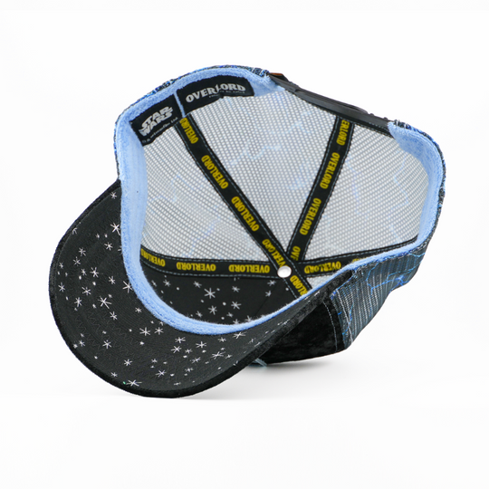Underside of the Emperor Palpatine trucker cap showing a starry black brim print with Star Wars tag, gray mesh crown, and yellow Overlord taping.