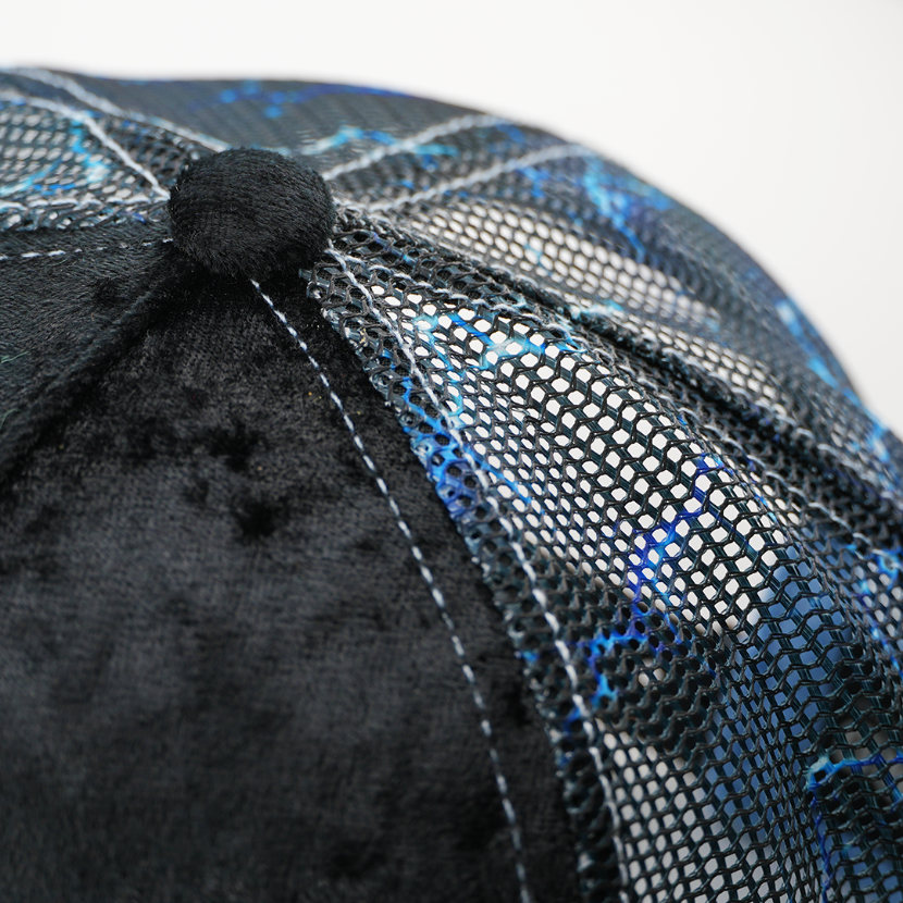 Close-up of the Emperor Palpatine trucker cap's crown button, black velvet panel, and lightning-print mesh side.