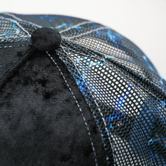 Close-up of the Emperor Palpatine trucker cap's crown button, black velvet panel, and lightning-print mesh side.