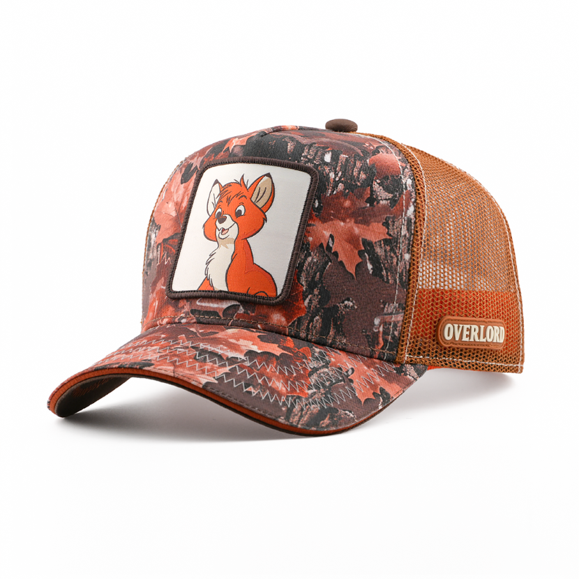 Rust and brown leaf-camo-print retro trucker cap with Tod from Disney's The Fox and the Hound patch on a white background, brown mesh sides, and an Overlord logo.