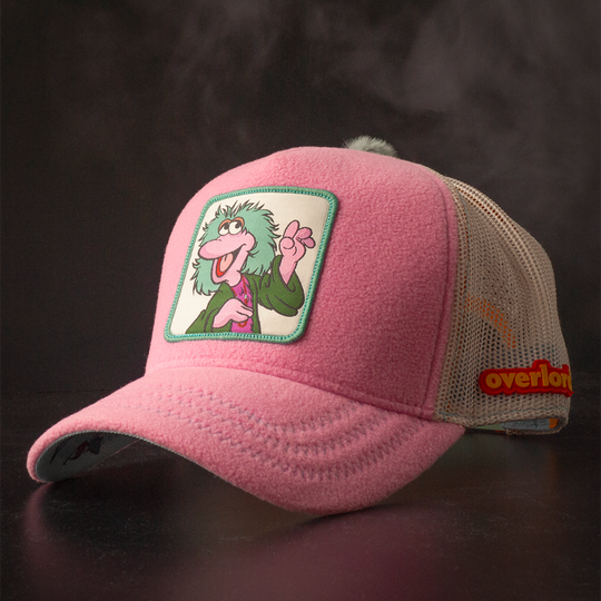 Purple fleece trucker cap hat with Fraggle Rock Mokey woven patch against black background