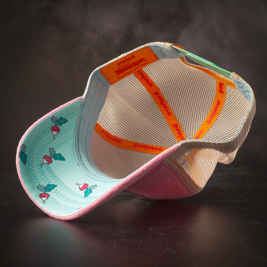 Inside view of purple fleece trucker cap hat with Fraggle Rock beets printed fabric on underbrim