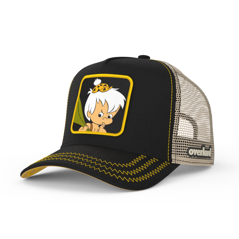 Black OVERLORD X Flintstones Bamm Bamm trucker baseball cap with yellow zig zag stitching. PVC Overlord logo.