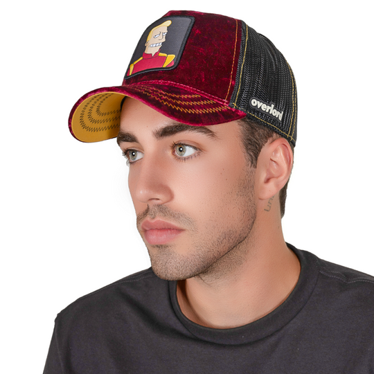 Man wearing dark red crushed velvet trucker cap featuring a woven patch of Zapp Brannigan from Futurama attached to the crown.