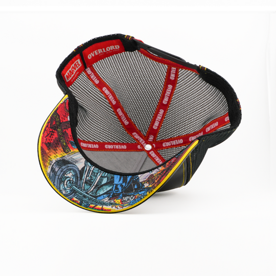 Underside view of the Ghost Rider cap showing a comic-print brim, black mesh crown, and red Overlord branded taping.
