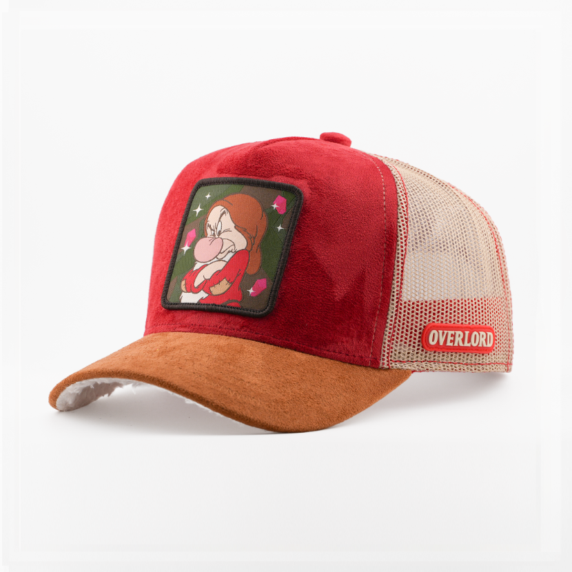 Red suede-textured Grumpy from Disney's Snow White and the Seven Dwarfs retro trucker cap with a brown brim, tan mesh side, and Overlord logo.