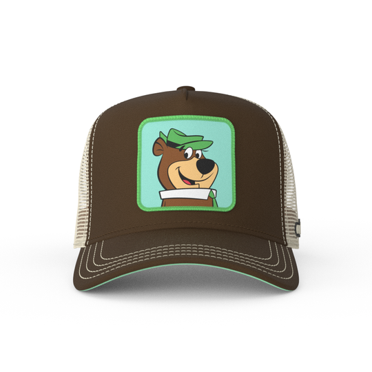 Brown twill trucker cap with khaki mesh featuring a woven patch of Yogi Bear attached to the crown.